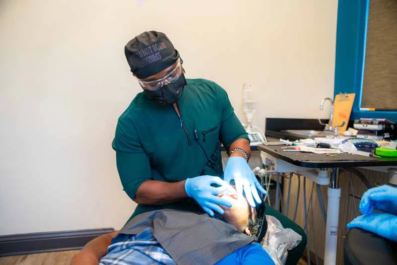 Dr. Emeka Abazie providing dental veneers for a patient